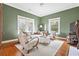 Comfortable living room with ample natural light, plush seating, and hardwood floors at 205 Mead Rd, Decatur, GA 30030