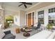 Inviting covered porch with stone pillars, comfortable seating, and views of the surrounding neighborhood at 205 Mead Rd, Decatur, GA 30030