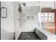 Detailed glass shower with a built-in bench and tile walls at 205 Mead Rd, Decatur, GA 30030
