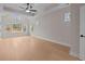 Expansive bedroom with wood floors, a ceiling fan, and plenty of natural light from multiple windows at 4770 Briscoe Dr, Cumming, GA 30028