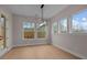Bright dining room with large windows offering natural light and hardwood floors, perfect for Gathering meals at 4770 Briscoe Dr, Cumming, GA 30028