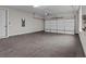 Spacious two-car garage with concrete floor and white door, ready for your vehicles at 4770 Briscoe Dr, Cumming, GA 30028