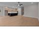 An open floor plan reveals a kitchen with barstool seating at the kitchen island at 4770 Briscoe Dr, Cumming, GA 30028