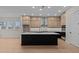 Modern kitchen features a large island with seating, stainless steel appliances, and abundant cabinet space at 4770 Briscoe Dr, Cumming, GA 30028