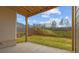 View of the yard from the covered patio, showing a retaining wall with steps at 4770 Briscoe Dr, Cumming, GA 30028