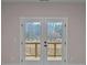 Elegant patio doors leading to an outdoor area, complemented by views of the natural surroundings at 4770 Briscoe Dr, Cumming, GA 30028