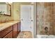 Comfortable bathroom with granite countertop vanity and a shower with tile surround at 798 Mann Rd, Villa Rica, GA 30180