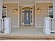 Front porch featuring a stylish front door and decorative exterior lighting at 798 Mann Rd, Villa Rica, GA 30180