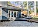 Relaxing back porch offers ample seating and a view of the fenced yard at 807 Longwood Dr, Atlanta, GA 30305