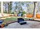 Landscaped backyard with seating area, a fence, and a shed and playhouse at 807 Longwood Dr, Atlanta, GA 30305