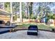 The backyard is well-maintained with a patio and a wooden fence surrounding the perimeter at 807 Longwood Dr, Atlanta, GA 30305