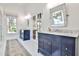 Stylish bathroom featuring double vanities, walk-in shower, and bright white tile flooring at 807 Longwood Dr, Atlanta, GA 30305