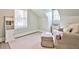 Bright bedroom with neutral tones, large windows, and built in shelving and storage at 807 Longwood Dr, Atlanta, GA 30305