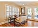 Bright dining area with bench seating, natural light, and access to the outdoor patio at 807 Longwood Dr, Atlanta, GA 30305
