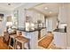 Stylish kitchen featuring white cabinetry, stainless appliances, breakfast bar, and an elegant rug at 807 Longwood Dr, Atlanta, GA 30305