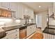 Bright kitchen features white cabinets, stainless steel appliances, and dark countertops at 807 Longwood Dr, Atlanta, GA 30305