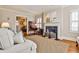 Elegant living room with fireplace, hardwood floors, and lots of natural light at 807 Longwood Dr, Atlanta, GA 30305