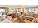 Open concept living room with kitchen view, comfortable seating, fireplace, and a neutral color scheme at 807 Longwood Dr, Atlanta, GA 30305