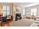 Elegant living room features a fireplace, hardwood floors, and bright natural light at 807 Longwood Dr, Atlanta, GA 30305
