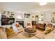 Spacious living room features a fireplace, custom built-ins, and an open floor plan at 807 Longwood Dr, Atlanta, GA 30305