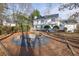 The backyard features a fire pit, deck, and lush greenery at 1040 Millridge Se Ln, Marietta, GA 30067