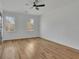 Bright bedroom with hardwood floors, ceiling fan, and windows providing natural light at 1040 Millridge Se Ln, Marietta, GA 30067