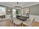 Inviting dining room with modern chandelier and ample natural light at 1040 Millridge Se Ln, Marietta, GA 30067