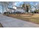 Charming two-story home with white siding, gray shutters, and well-maintained landscaping at 1040 Millridge Se Ln, Marietta, GA 30067