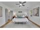 Bright and airy main bedroom with a ceiling fan, ample natural light, and ensuite bathroom entrance at 1040 Millridge Se Ln, Marietta, GA 30067