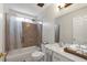 Clean bathroom featuring a shower-tub combination and a well-lit vanity area at 2685 Archer Way, Dacula, GA 30019