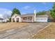 Charming single-story home with a cozy front porch, garage, and long driveway at 2685 Archer Way, Dacula, GA 30019