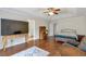 Spacious main bedroom boasting a ceiling fan, a walk-in closet, and ensuite bathroom access at 2685 Archer Way, Dacula, GA 30019