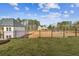 Expansive backyard with black fence and ample space for outdoor activities at 4480 Beechnut Cir, Cumming, GA 30028