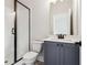 Modern bathroom featuring a glass-enclosed shower and stylish vanity with black hardware at 4480 Beechnut Cir, Cumming, GA 30028