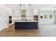 Open-concept kitchen with a large island, stainless steel appliances, and plenty of storage at 4480 Beechnut Cir, Cumming, GA 30028