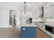 Stylish kitchen with center island, pendant lighting, and stainless steel appliances at 4480 Beechnut Cir, Cumming, GA 30028