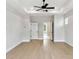 Spacious main bedroom with hardwood floors, a ceiling fan and neutral color scheme at 4480 Beechnut Cir, Cumming, GA 30028
