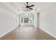 Sun-filled main bedroom with hardwood floors, tray ceilings, and a relaxing atmosphere at 4480 Beechnut Cir, Cumming, GA 30028