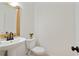 Stylish powder room with a pedestal sink and decorative mirror at 29 Ivy Ne Trl, Atlanta, GA 30342