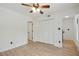 Bright bedroom featuring a closet, light wood floors, and white paint to create a spacious and airy atmosphere at 29 Ivy Ne Trl, Atlanta, GA 30342