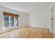 Light-filled bedroom featuring large windows and hardwood floors at 29 Ivy Ne Trl, Atlanta, GA 30342