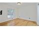 Bright bedroom with hardwood floors and natural light from the window at 29 Ivy Ne Trl, Atlanta, GA 30342
