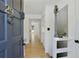 Inviting entryway featuring a wood floor, neutral walls, and a charming front door at 29 Ivy Ne Trl, Atlanta, GA 30342