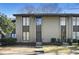 Inviting townhouse with a well-manicured front yard and neutral exterior, creating a charming curb appeal at 29 Ivy Ne Trl, Atlanta, GA 30342