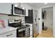Well-equipped kitchen featuring stainless steel appliances and white cabinets at 29 Ivy Ne Trl, Atlanta, GA 30342