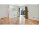 Living room featuring wood floors, neutral walls, and a sliding door that leads to an outdoor patio at 29 Ivy Ne Trl, Atlanta, GA 30342