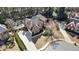 Aerial view of the brick home with lush landscaping, a pool, and circular driveway at 832 Forest Path Ln, Alpharetta, GA 30022