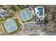 Aerial view of community tennis courts and pool offering great recreational amenities at 832 Forest Path Ln, Alpharetta, GA 30022