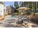 Inviting backyard features an outdoor dining set, inground pool and patio space at 832 Forest Path Ln, Alpharetta, GA 30022