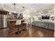 Finished basement bar with wood accents, pendant lighting, stools, and hardwood floors at 832 Forest Path Ln, Alpharetta, GA 30022